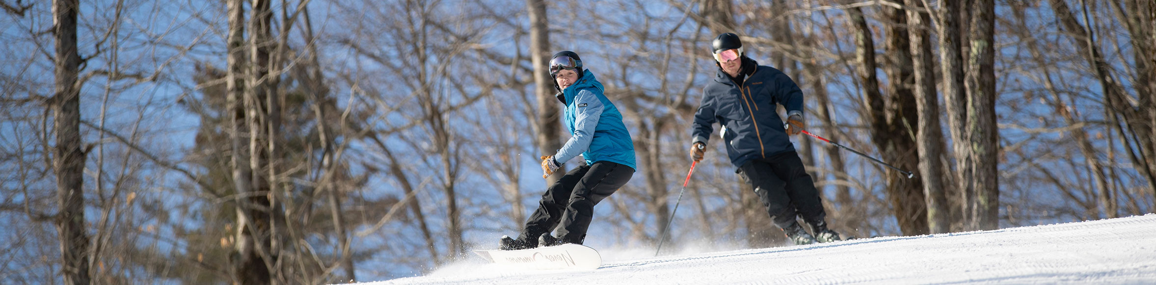 Snowboarder and Skier